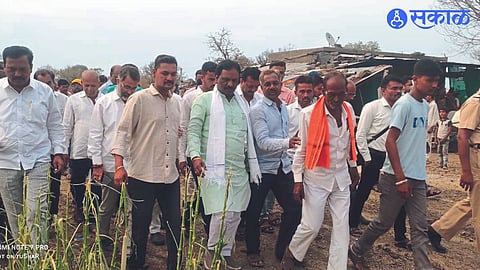 Ambadas Danve neighboring officials and farmers inspecting the fields damaged by hail in Nana Thorat's farm.
