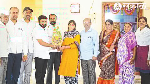 Sarpanch Sachin Yadav felicitating Sakshi Phad on his appointment in the police force