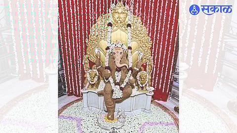 On Sunday, the silver Ganesha at Karanja was coated with 21 kg of sandalwood due to the heat. Floral decoration of mogra around.