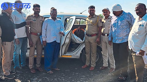 Assistant Inspector Suresh Shirasat and colleagues while inspecting the seized car.