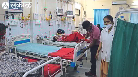 Employees putting up a signboard for the heat stroke room after an inquiry at the district hospital and medical college on Monday