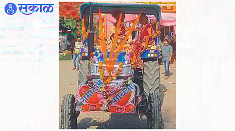 Groom Samadhan Mahajan with bride on tractor