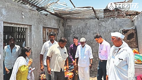 Babanrao uncle Sakharchand Bachchav with Dilip Borse while inspecting the damaged house of Bhausaheb Bachchav in Navi Shemli.