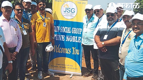 Officials giving water tanks by Jain Social Group.