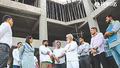 Guardian Minister Dada Bhuse inspecting the work of the new building of Zilla Parishad on Monday.