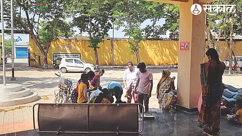 Health workers treating a woman who has given birth at the entrance of Chandori Primary Health Centre.