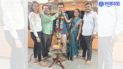 Father Sanjay Khairnar, mother Kalpana and family celebrating their first rank in the state in the Maharashtra Public Service Commission examination.