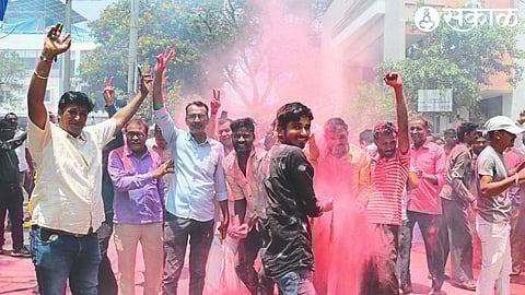 Activists cheering after the results of market committee election on Sunday.