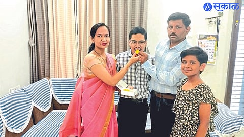 Malegaon City: Mother Vaishali and father Chandrasingh Solunke applauding Aryan for overcoming cerebral palsy in his 12th art class at KBH School.