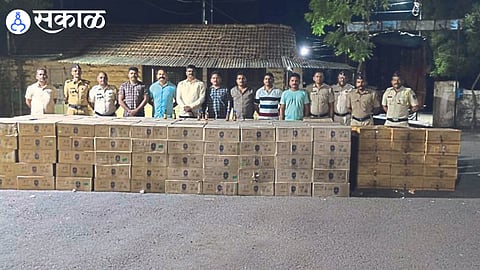 Police officer with after seizure of illegal liquor stock going to Gujarat.