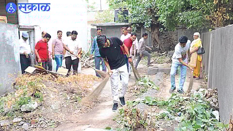 Volunteers while cleaning the court premises in an initiative organized by Gandhi Research Foundation and District Justice Authority in the Beautiful, Clean City campaign.