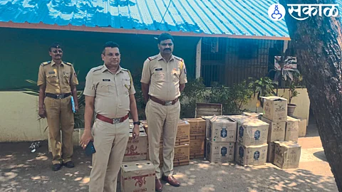 Sub Divisional Police Officer Sachin Hire, Police Inspector Dnyaneshwar Vare etc. along with the liquor seized by the police.