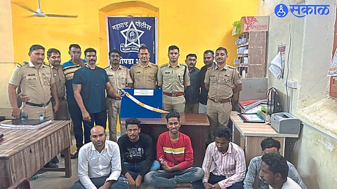 Chopra: Police officers and staff with six suspects in custody.