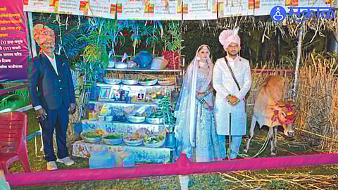 Bride Rituja and groom Prasad accepting gifts from Shyam Mogul.