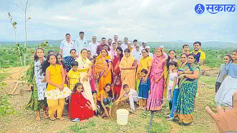 A child planting seedballs after seed samskara by Akhil Bharatiya Shri Swami Samarth Sevamarga. Neighbor servants.