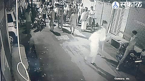 A young man arguing with a bike rider blocking the road.