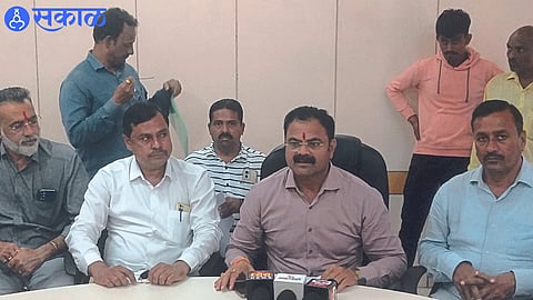 MLA Kishore Patil while giving information in a press conference at Agricultural Income Market Committee hall.