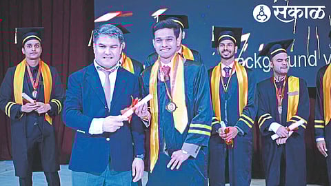 Dr. Atharv Tatar receiving Bachelor of Medicine and Bachelor of Surgery degrees from Osh State Medical University Vice-Chancellor Roman Kalmarov in Russia.