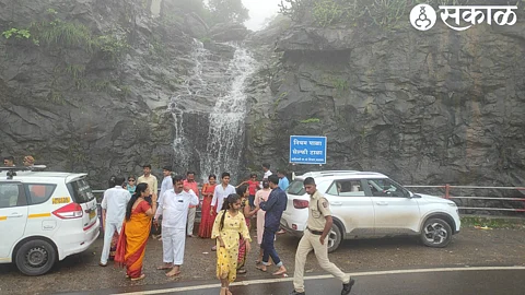 Spectacular view of the temple in the fog. In the second picture, the waterfalls falling in the ghat and the youth enjoying themselves.
