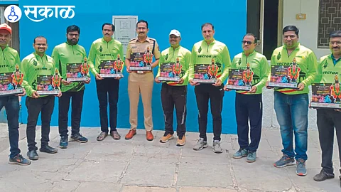Deputy Superintendent of Police Abhay Singh Deshmukh with cyclists.