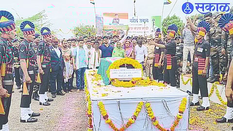 Soldiers of 169 Artillery Regiment paying their respects to martyr Manoj Mali on Sunday.
