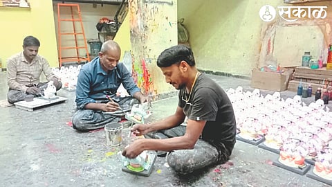 Sculptor creating plaster of Paris Ganesha idol.