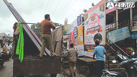 Gram Panchayat staff confiscating hoardings obstructing traffic