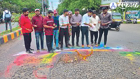 citizen performing symbolic puja on road in front of the collector office.