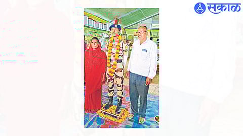 Kamini with parents.