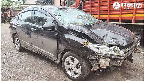 A striking black Honda City car.