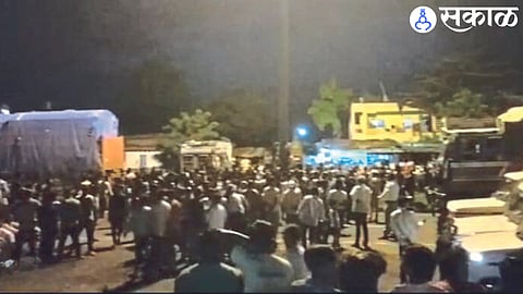 Vehicles blocked by mob blocking road after riots.