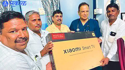 While handing over the LED Smart TV to the school teachers, Dr. Narayan Sonawane.