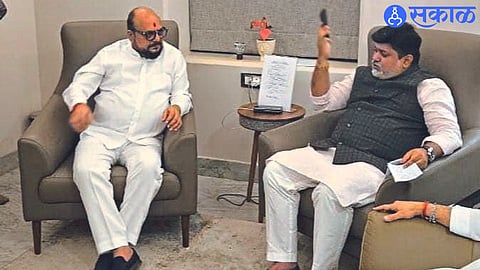 Guardian Minister Gulabrao Patil in discussion with Industry Minister Uday Samant.