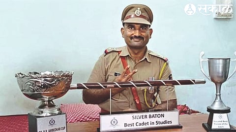 Sub-Inspector of Police Kiran Deore with the trophies at the convocation ceremony