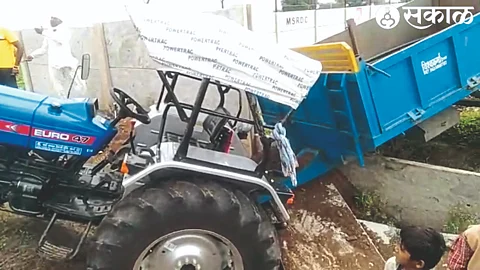 A tractor and a stolen trolley stuck in Samriddhi's protective fence along the Maldhon-Mirgaon road.