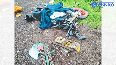 A motorcycle rider injured in an accident.