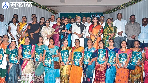 Chhagan Bhujbal, Seema Hire and beneficiaries during the 'Anandacha Shidha' distribution program
