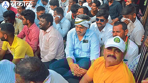 MLA Rohit Pawar sitting in public during Sharad Pawar's meeting on Tuesday.