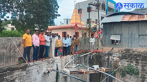 Officials and members of Shri Kaka Ganesh Mandal here who implement water recharge activities.