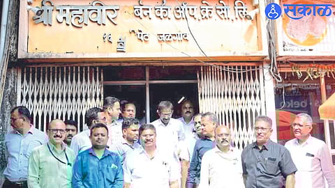 Officers of the District Bank during the confiscation operation at the office of Mahaveer Credit Union in Navi Peth.