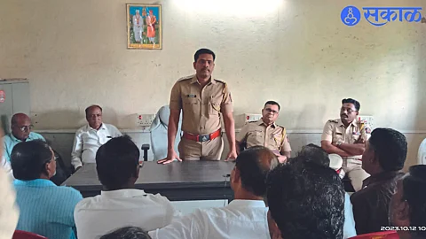 Upper Police Inspector Ramesh Chopde appealing for peace in the Peace Committee meeting.
