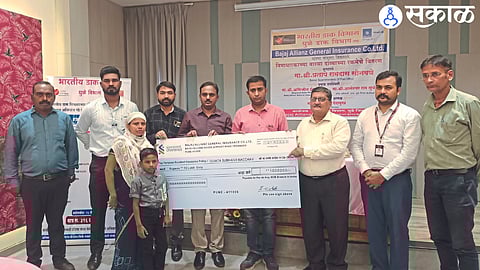 Post Account, Officers of Bajaj Allianz Company while issuing the accident insurance amount check to the heirs of the beneficiary.