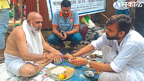 During the pinddan ritual on behalf of his wife at Godaghat, Patnipidit Prof. Shankar More.