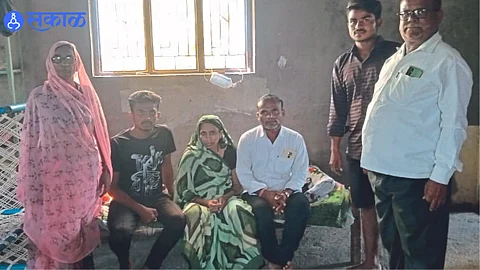 After coming home, Johar Tadvi sitting with his wife Salima family, children and their parents standing.