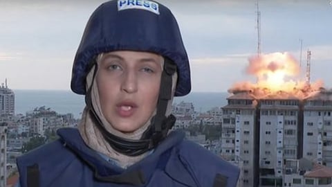 israel missile strikes palestine tower behind reporter live on Air video goes viral Israel Palestine Conflict