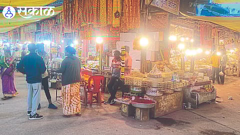Shops lined with garlands, prasad in front of Sri Bhagwati's temple steps.