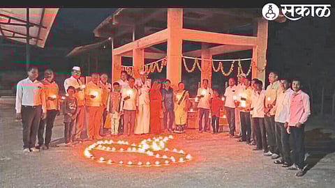 The graveyard lit up with the lights of ancestors on the occasion of Deepotsav. In the second photo, Bhajani Mandal and villagers performing Bhajan.