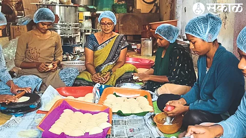 Women making Karanji for Diwali.