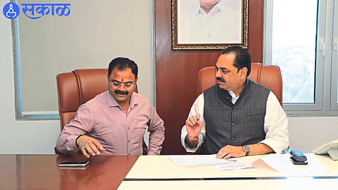 MLA Kishore Patil discussing drought declaration with State Relief and Rehabilitation Minister Anil Patil.