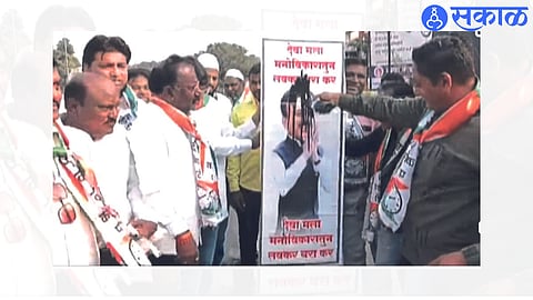 black ink thrown on Minister Mahajan poster by ncp jalgaon news